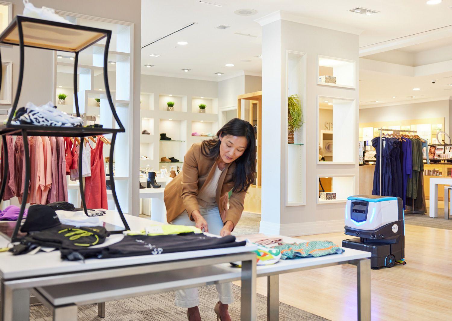 Cobi 18 , robotic floor scrubber, cleaning floors in retail store