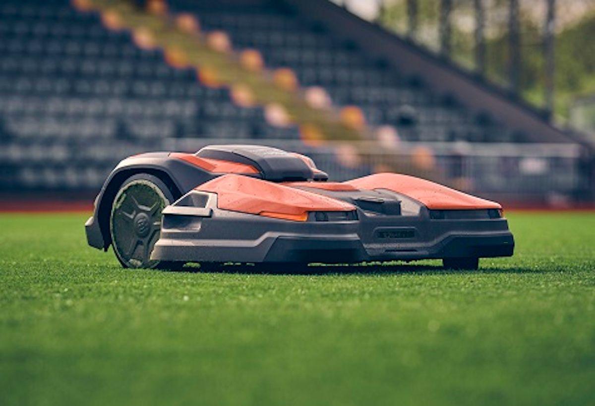 lawncare robot mowing college stadium lawn