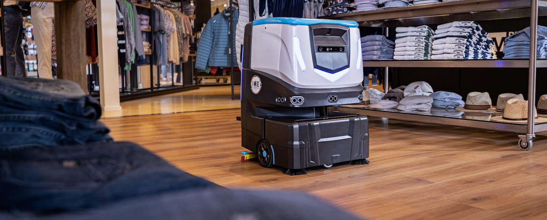 ICE Cobotics Cobi 18 cleaning floors in clothing retail store