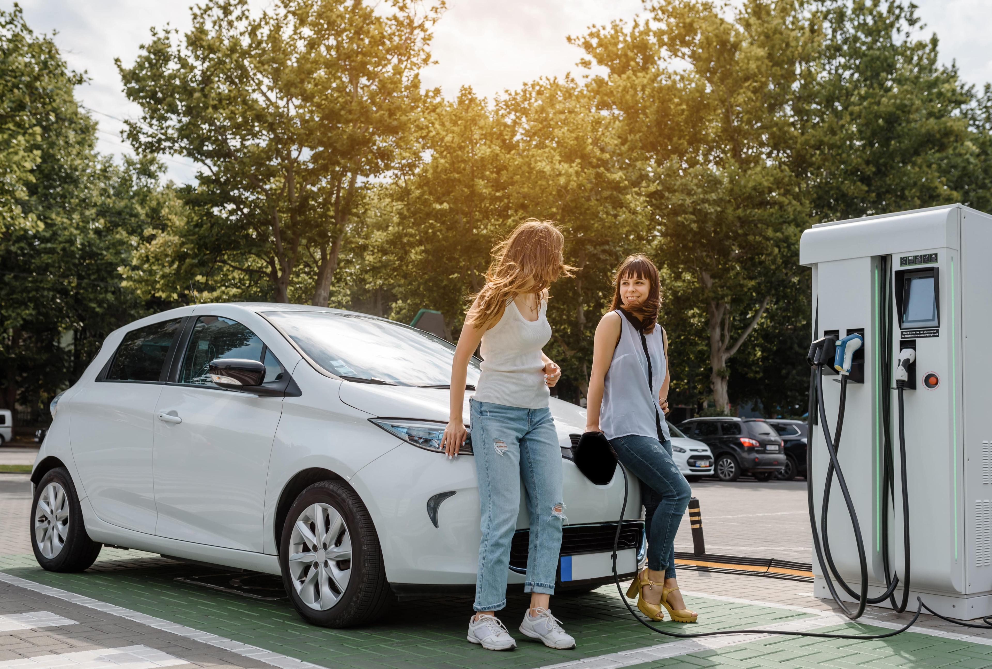 electric car charging at electric vehicle charging station