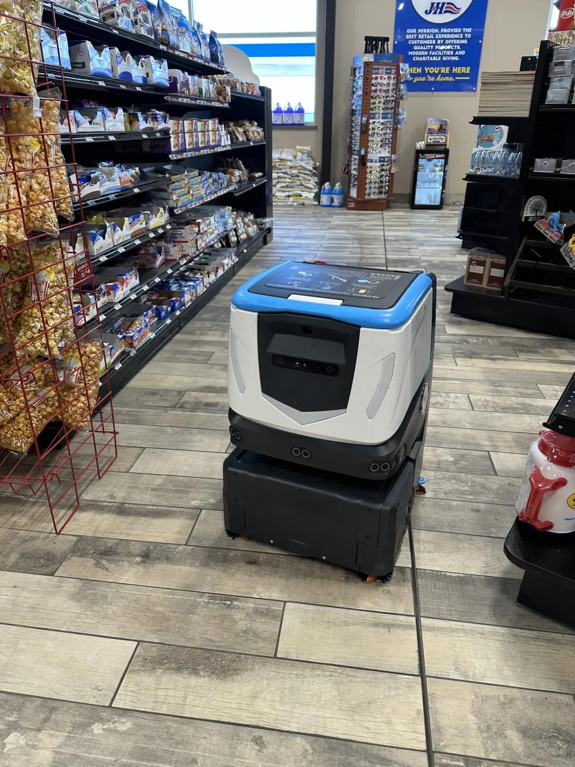 floor cleaning robot cleans convenience store gas station floors