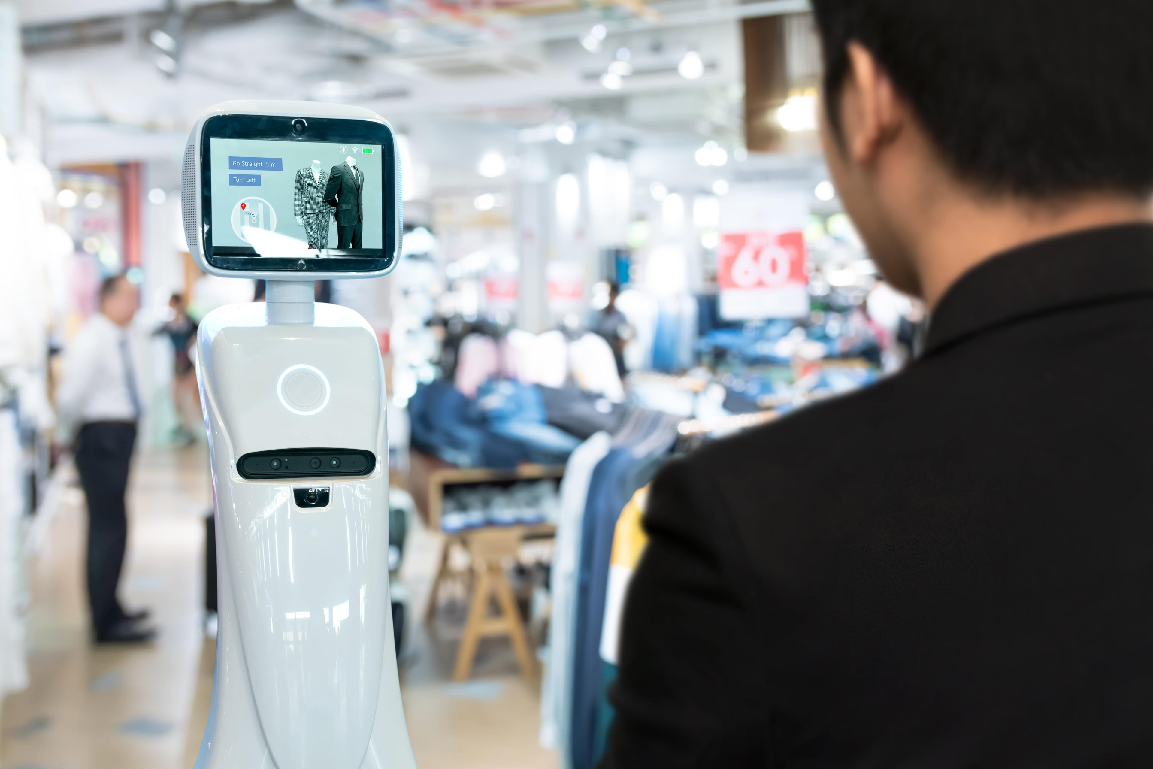 smart technology in retail store: customer trying on clothes with a smart mirror