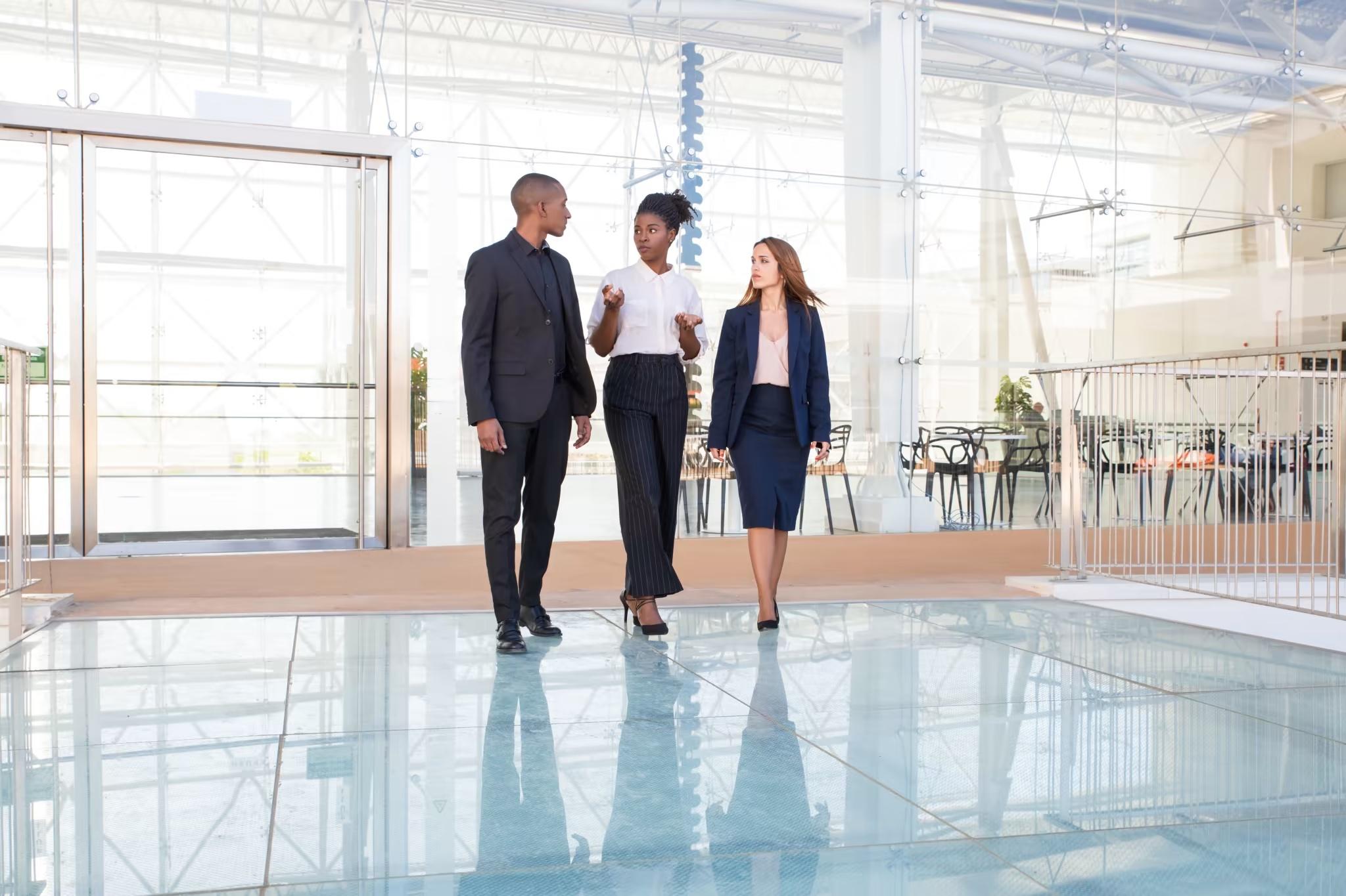 three employees walking in a super clean commercial property