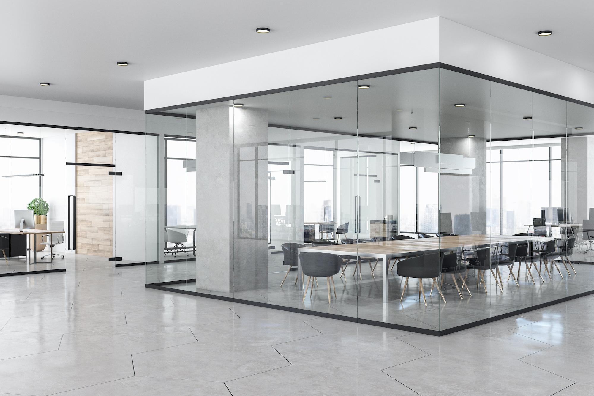 Modern office setting with glass walls and lots of windows and very clean floors 