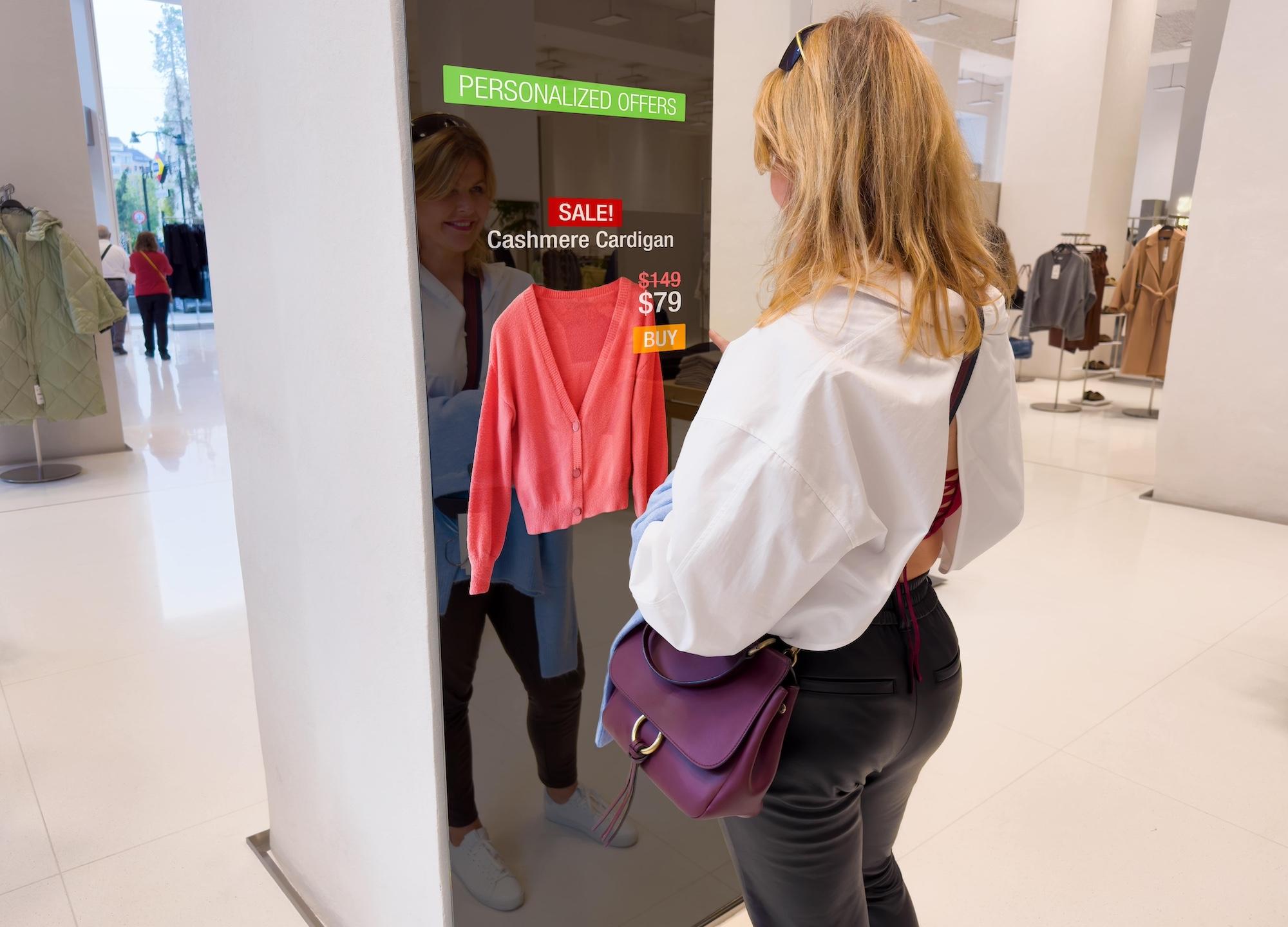 woman trying on clothes using a retail store smart mirror