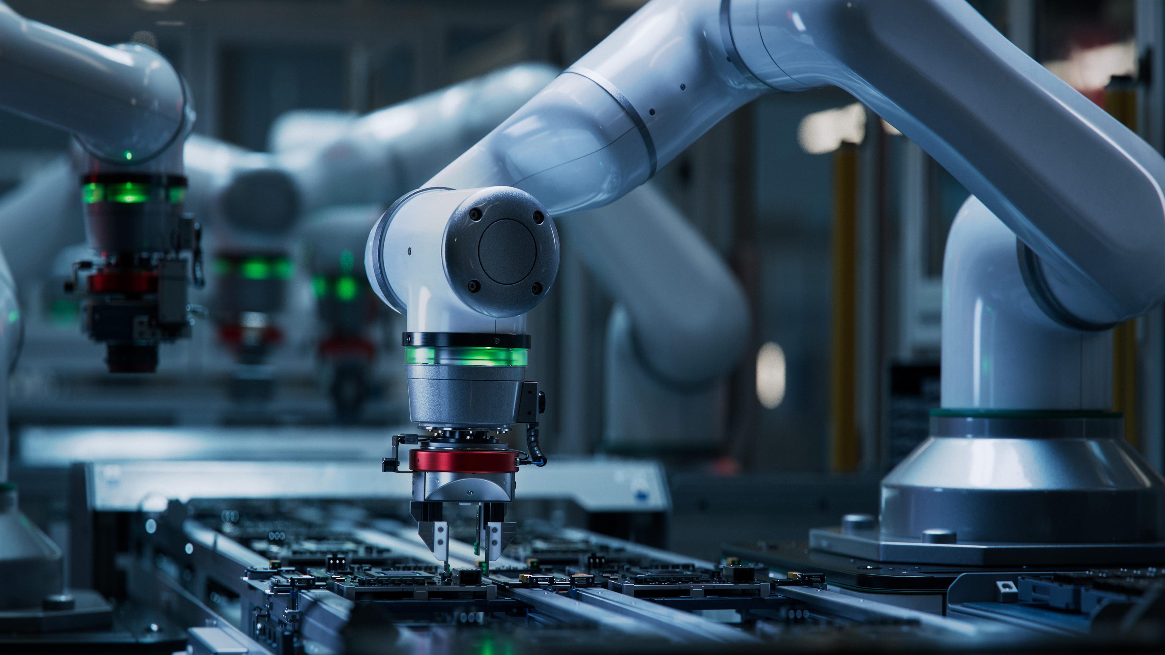 SCARA precision robotics arms inside electronics factory