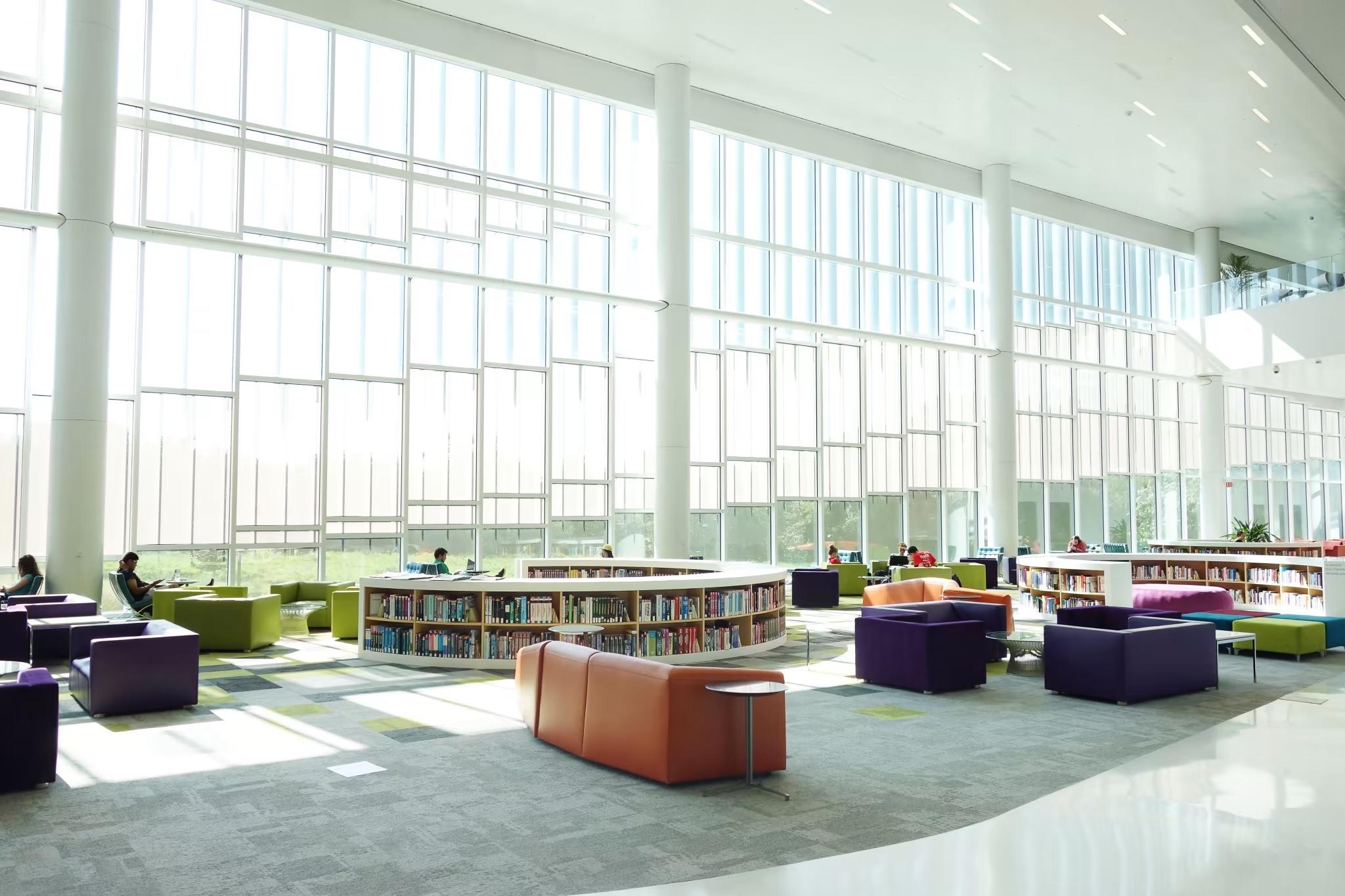 college campus library with expanisive wall of windows in higher education facility